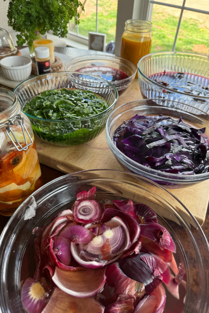 a variety of colorful foods in boiling water to create dye