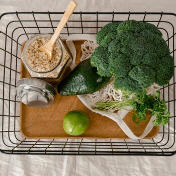 A basket of fresh produce and oats promoting a healthy and sustainable lifestyle.